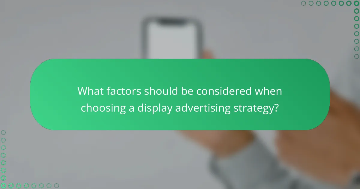 What factors should be considered when choosing a display advertising strategy?